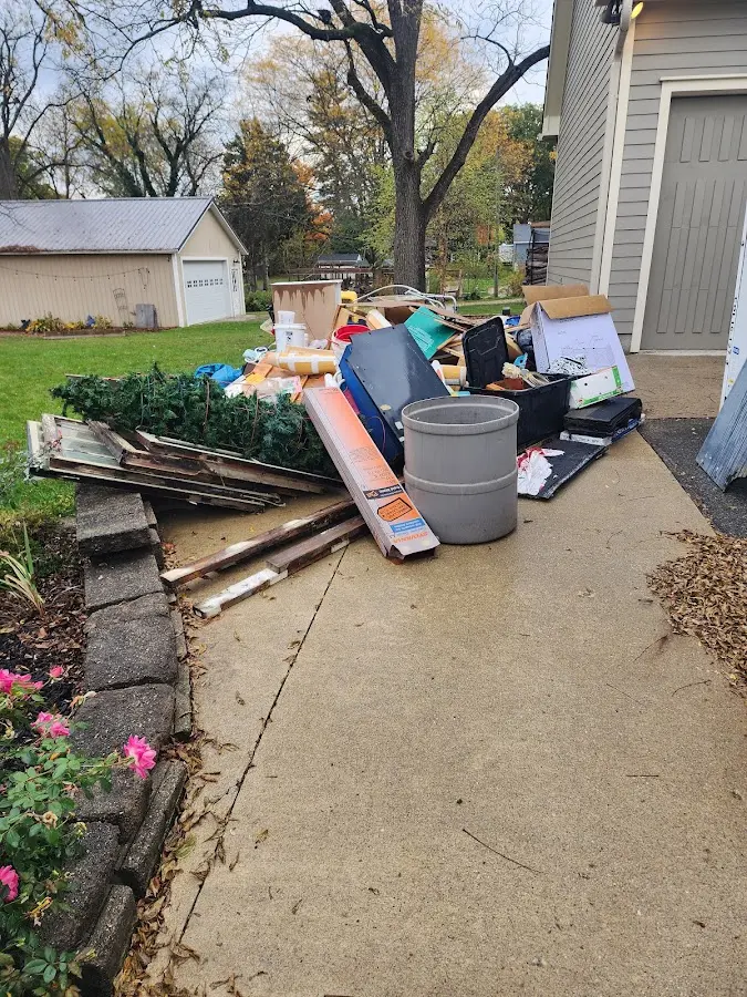 Dumpster being loaded with debris for Commercial Dumpster Rental in Savoy